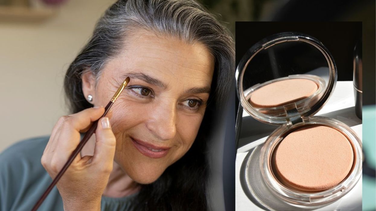 Woman applying makeup