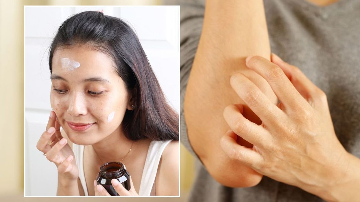 Woman applying moisturiser to her face
