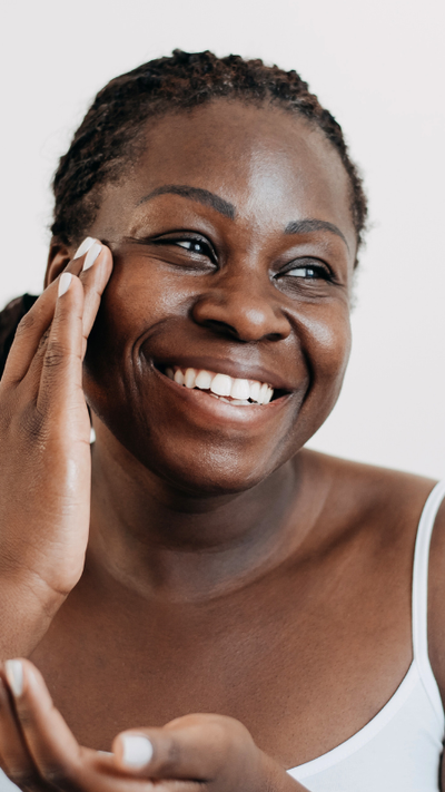 Woman applying skin care / fruits and vegetables