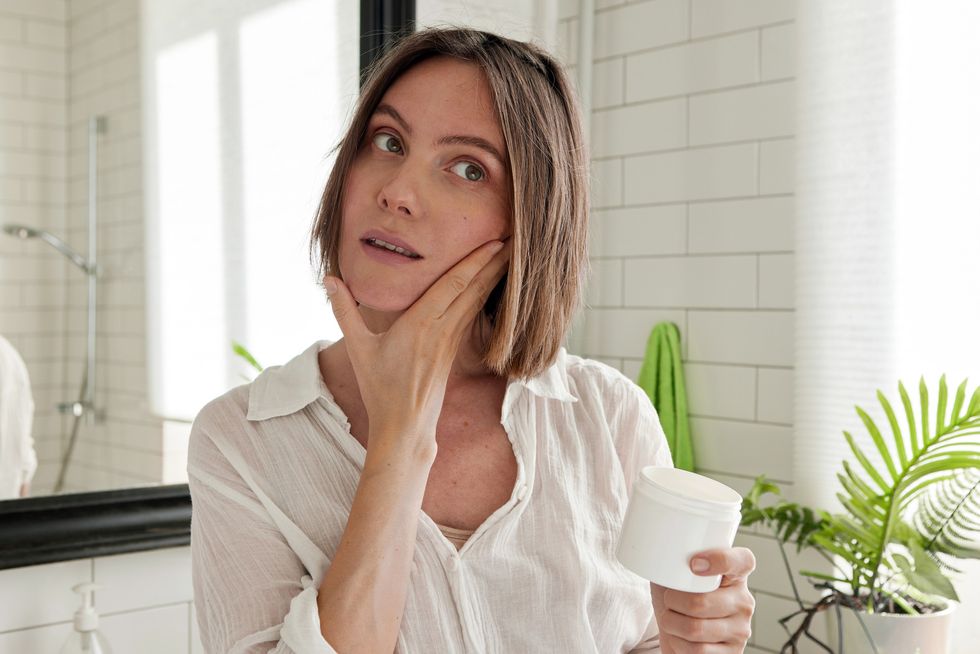 Woman applying skin care