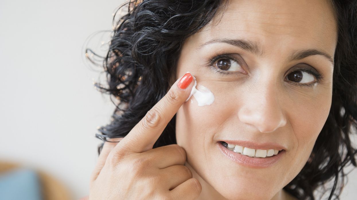Woman applying sunscreen