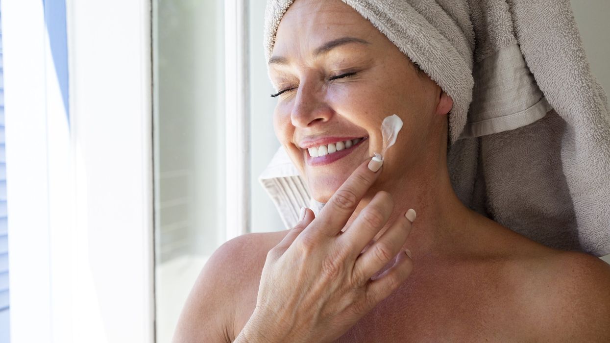 Woman applying sunscreen