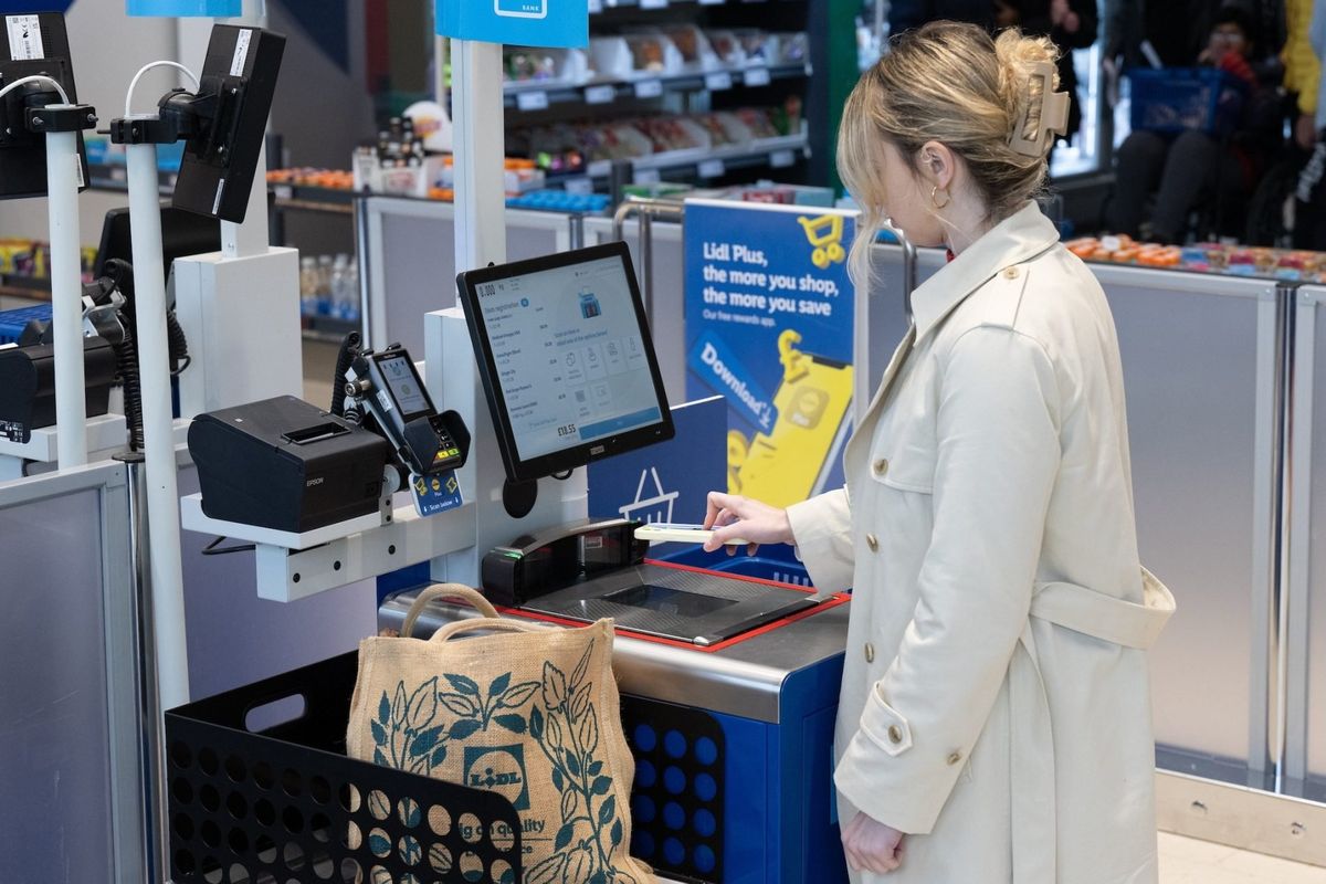 Woman at a Lidl self-checkout