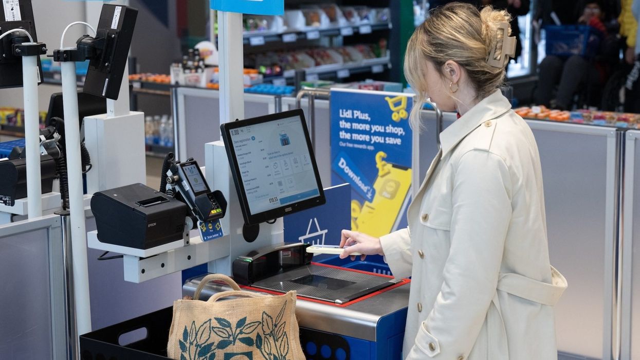 Woman at a Lidl self-checkout