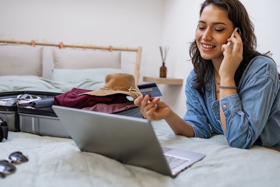 Woman booking holiday on computer