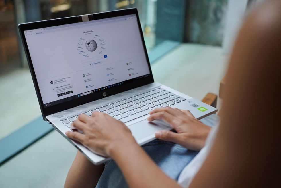 Woman browsing Wikipedia