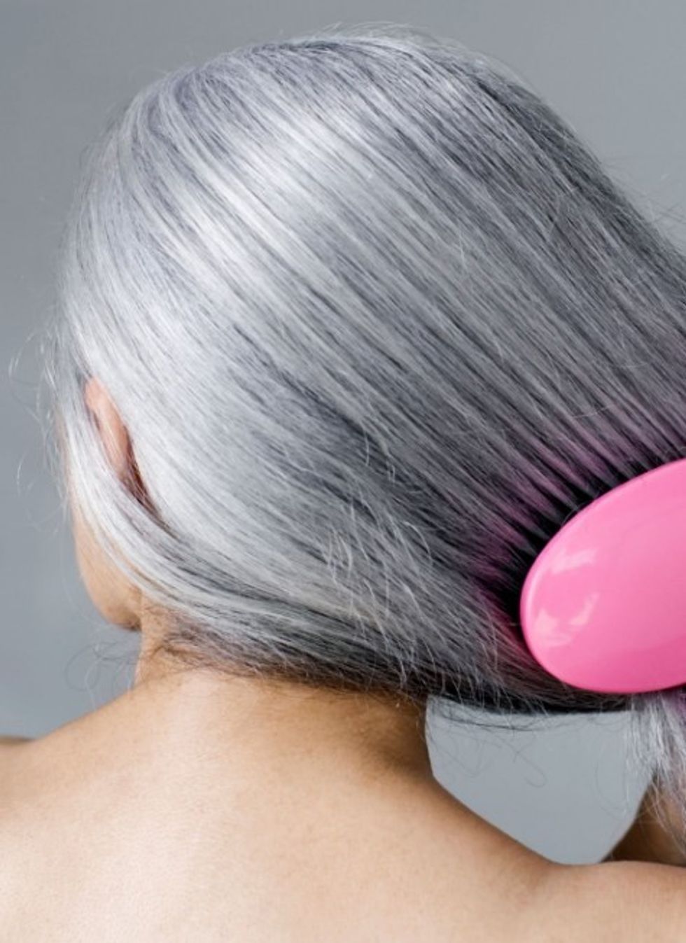 woman brushing long hair