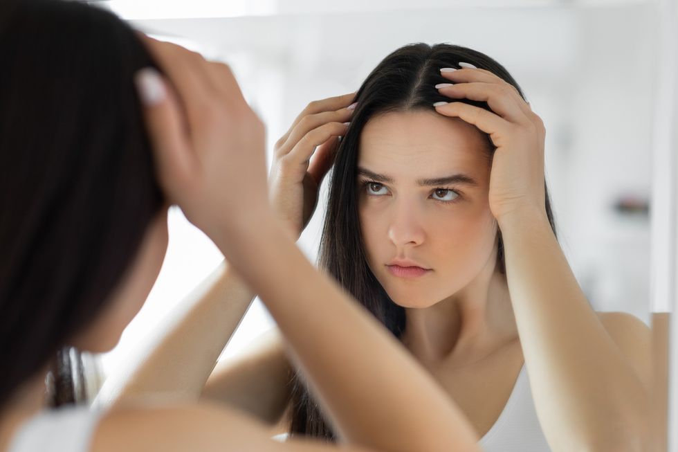 Woman checking for hair loss