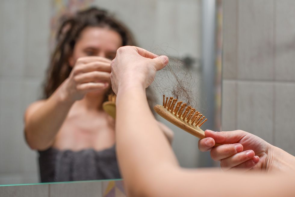 Woman checking for hair loss