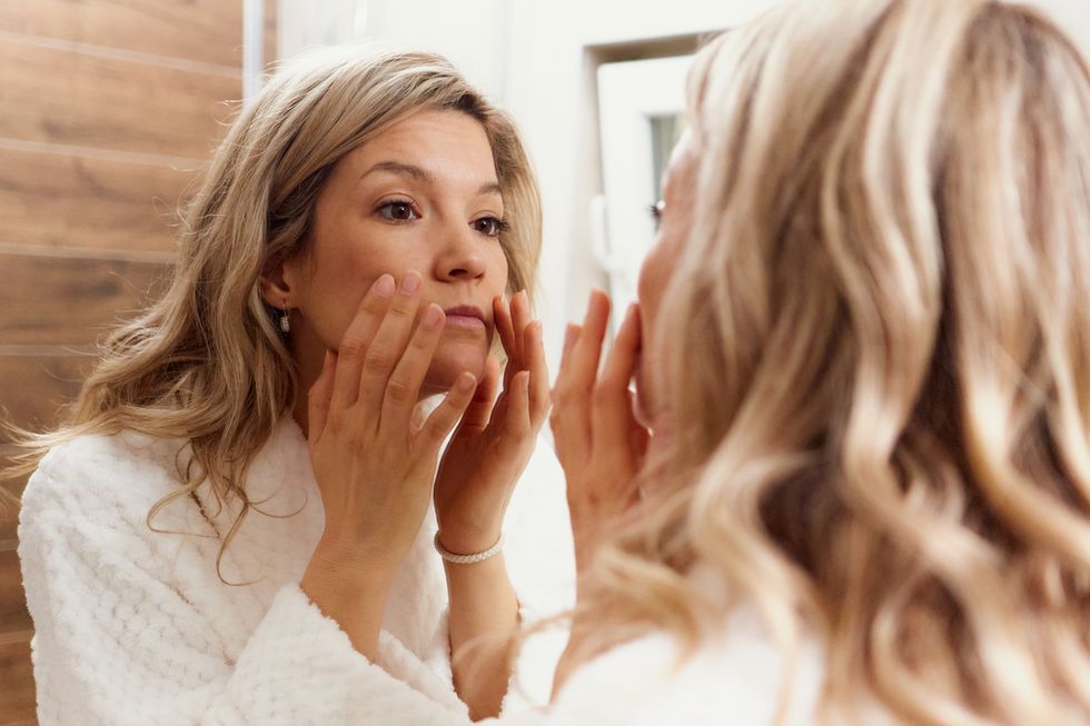 Woman checking in the mirror
