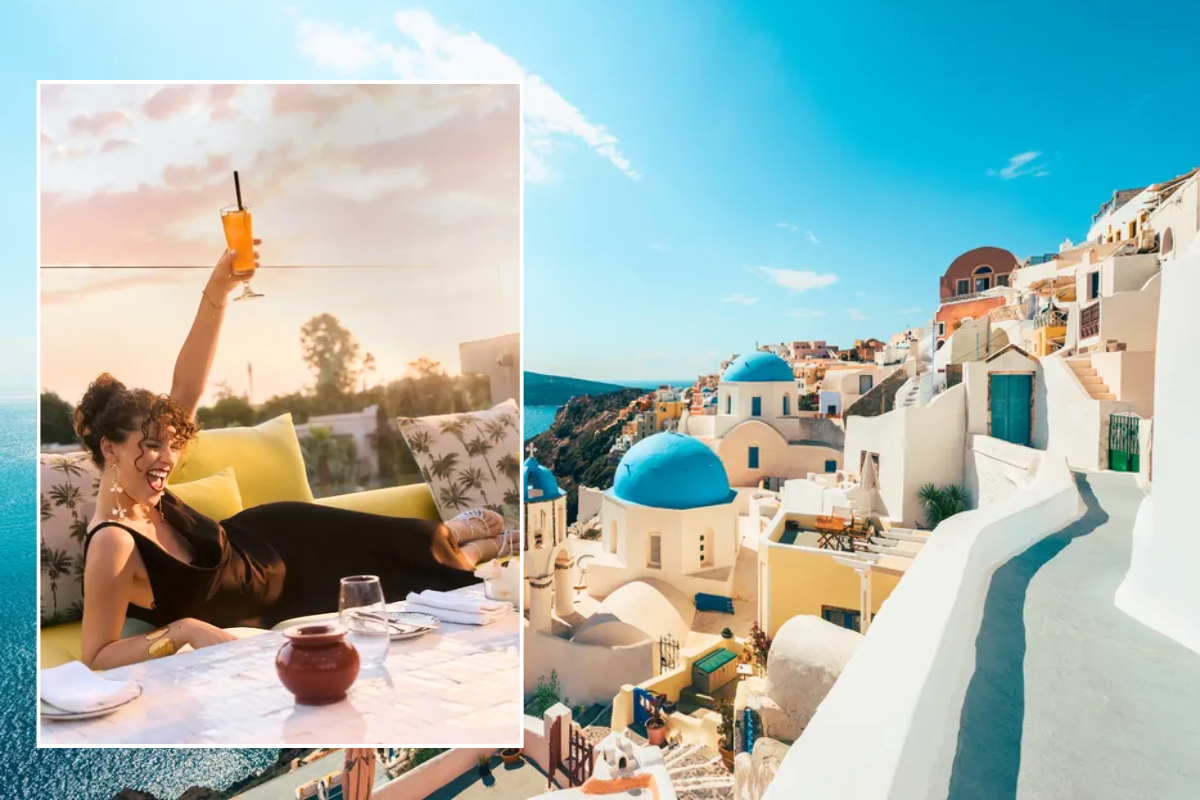 Woman cheers on holiday / Santorini, Greece