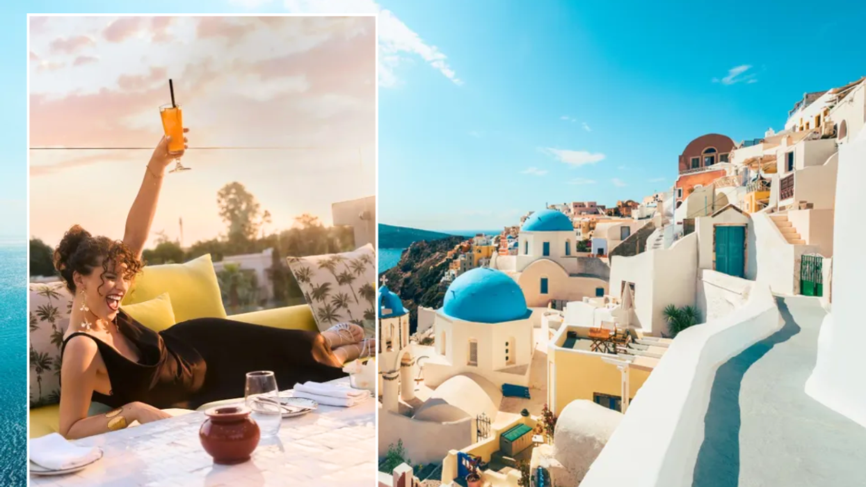 Woman cheers on holiday / Santorini, Greece