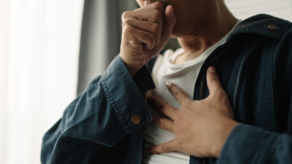 Woman clutching her chest