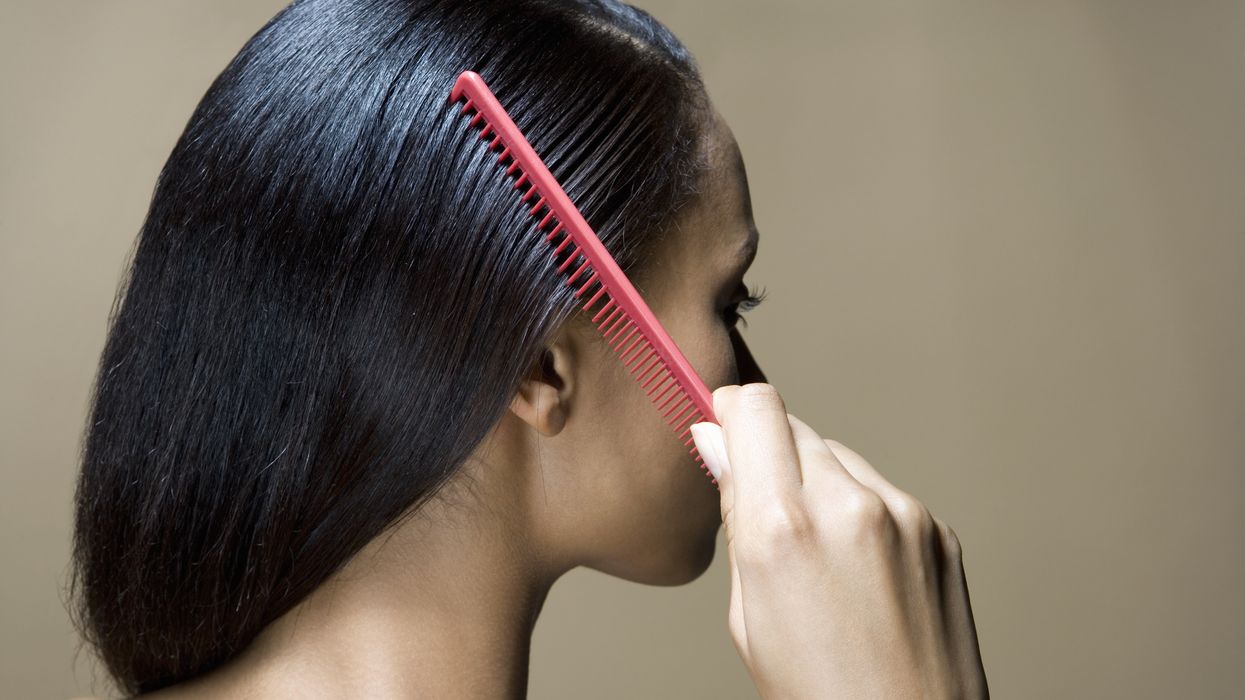 Woman combing hair