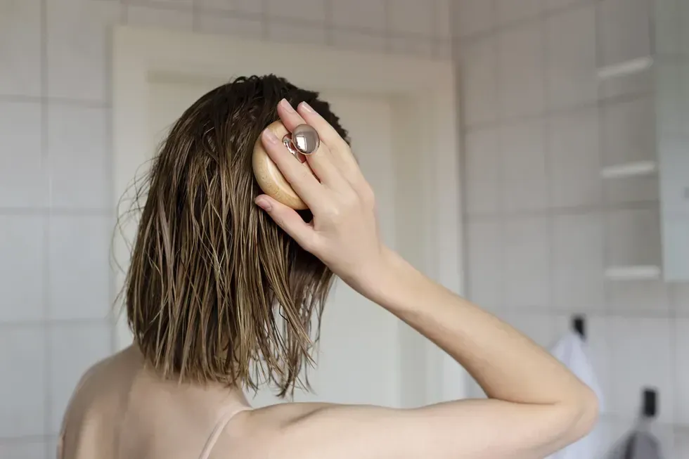 woman combing hair