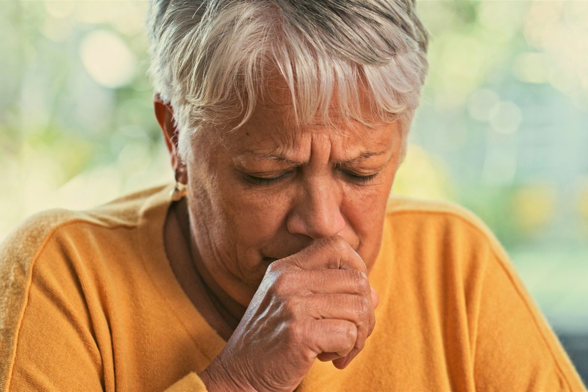 Woman coughing