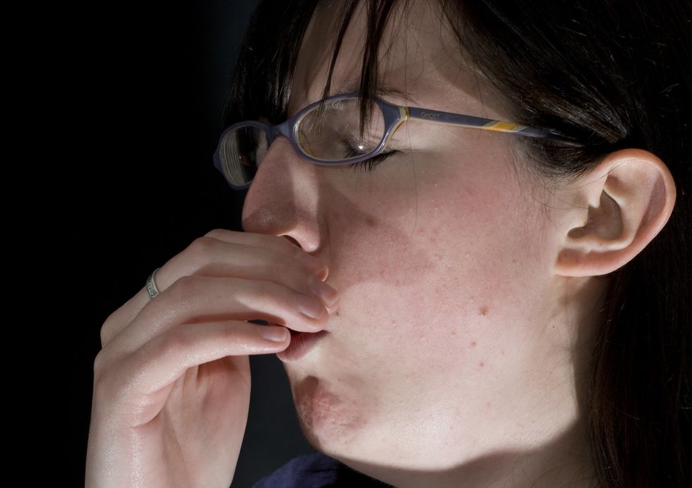 Woman coughing