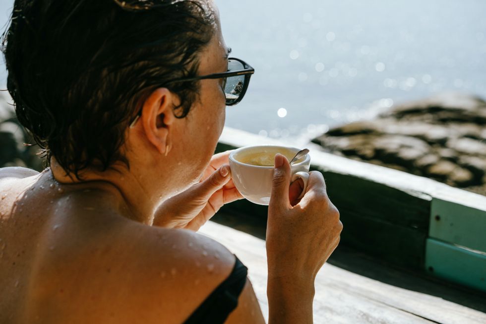 WOMAN DRINKING COFFEE