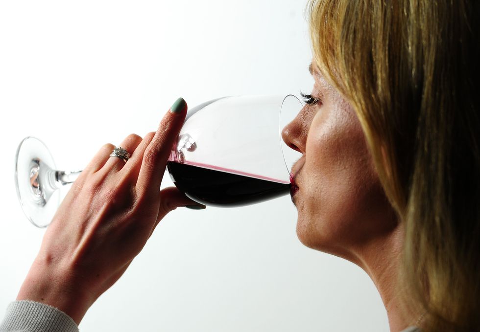 Woman drinking red wine