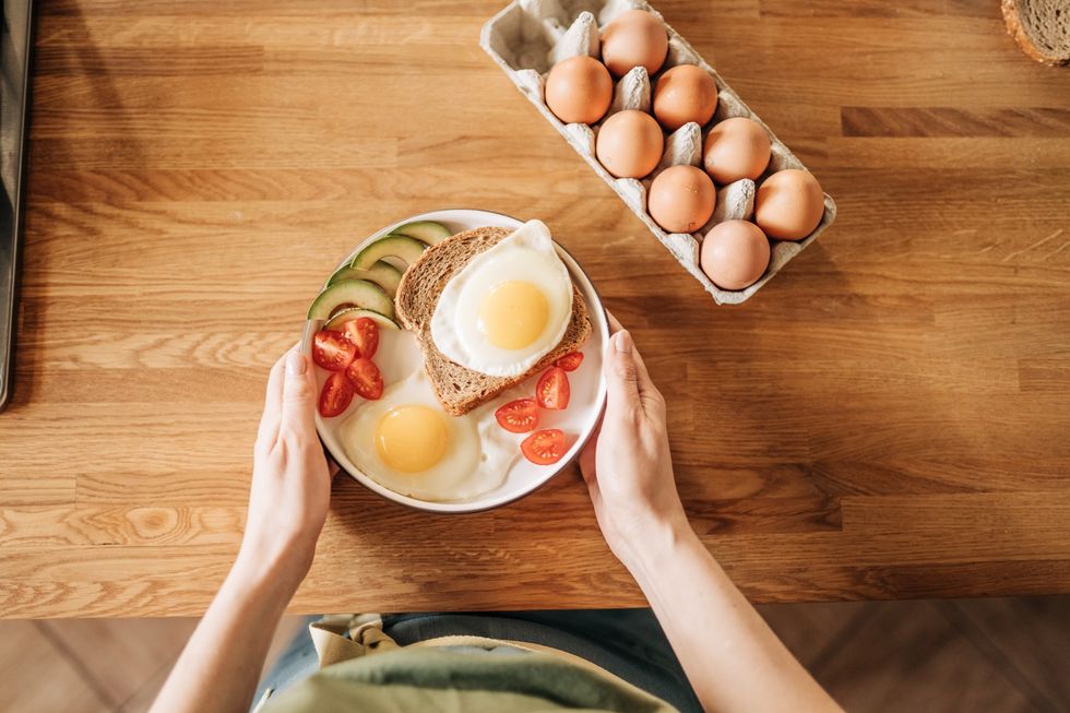 Woman eating a high-protein breakfast