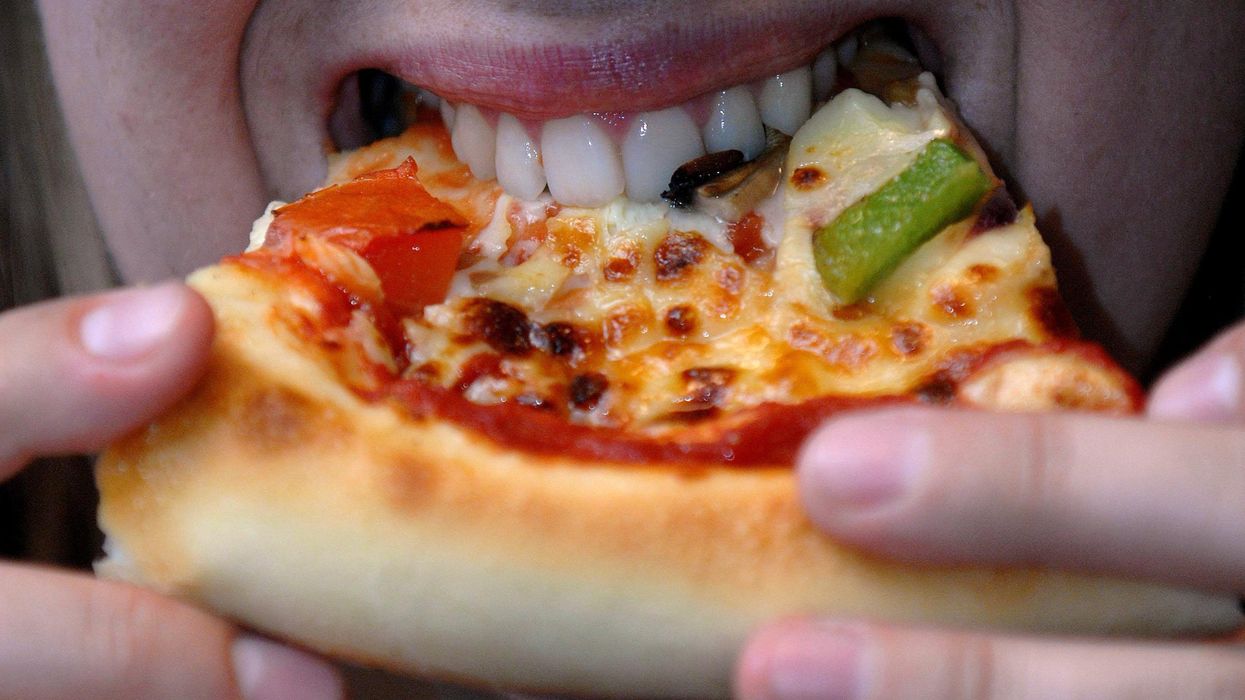 Woman eating a pizza