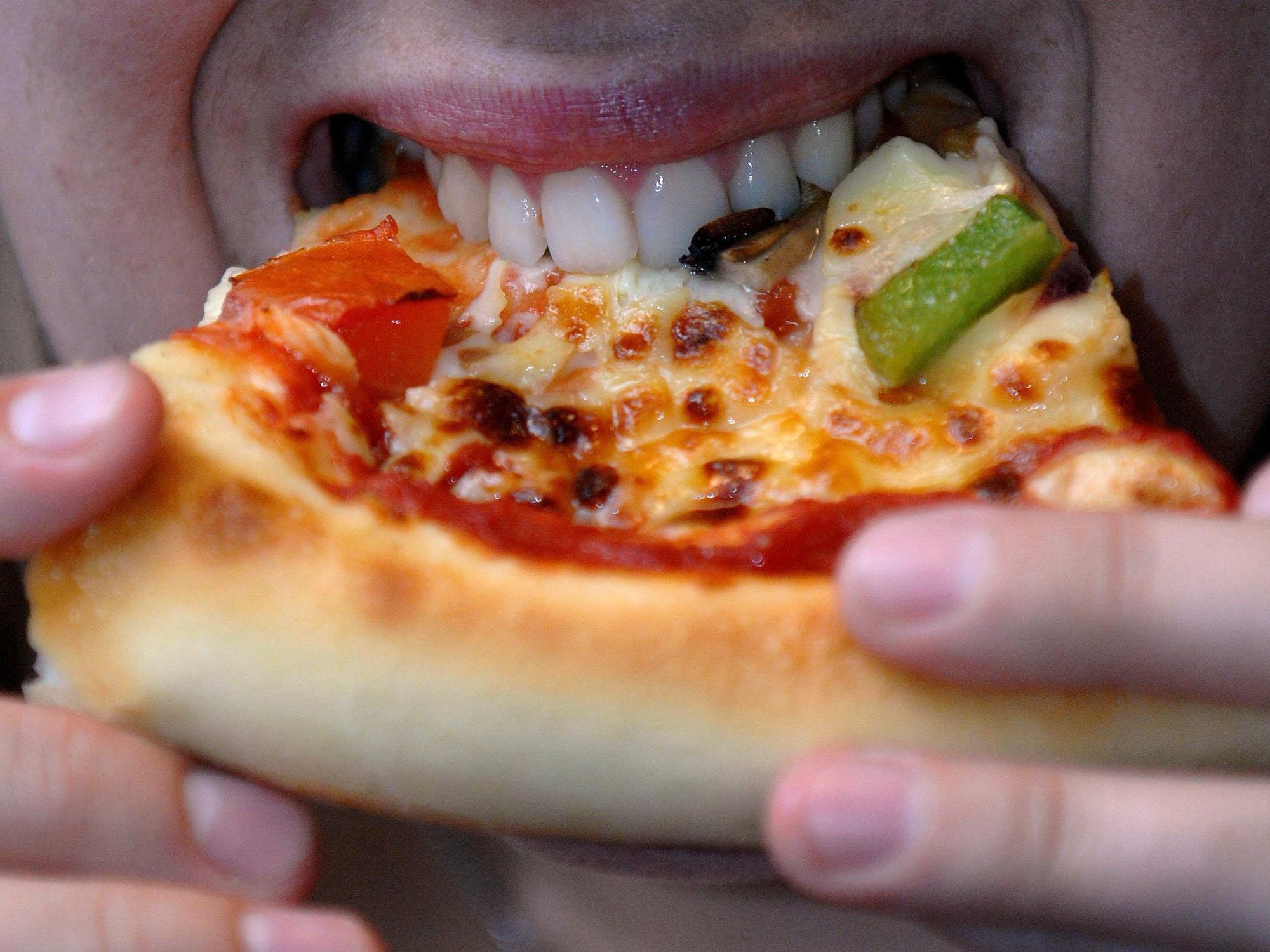Woman eating a pizza