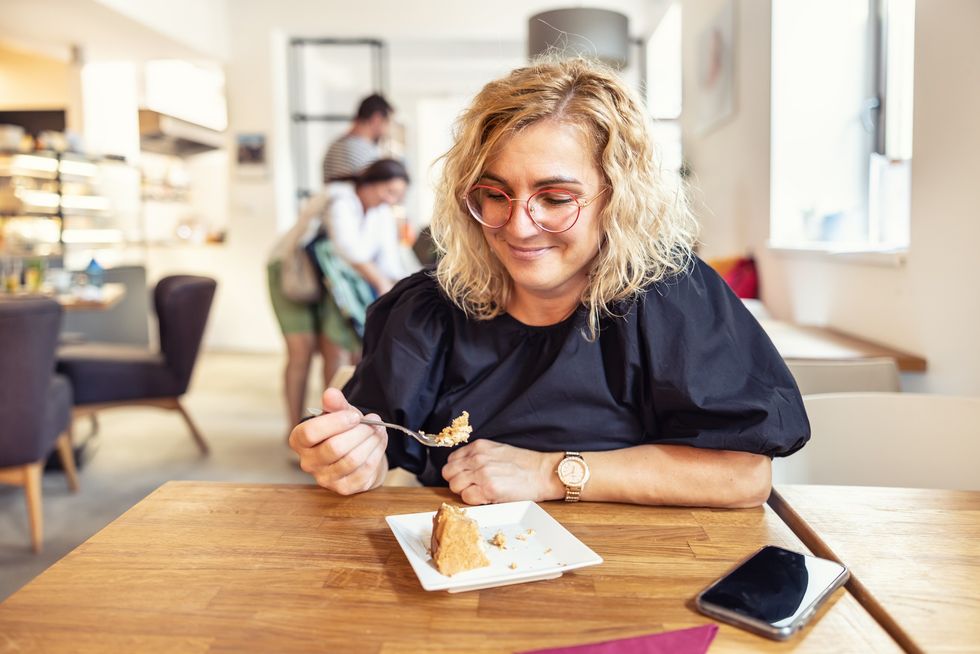 Woman eating cake