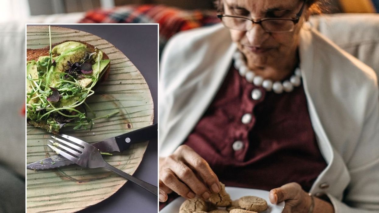 woman eating cookies and plate of food