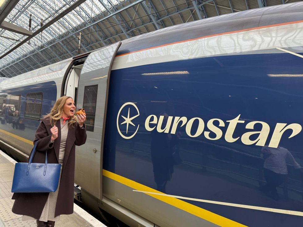 Woman eating croissant by Eurostar