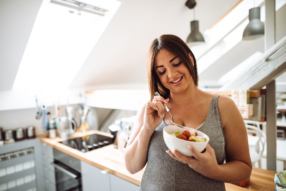Woman eating fruit salad
