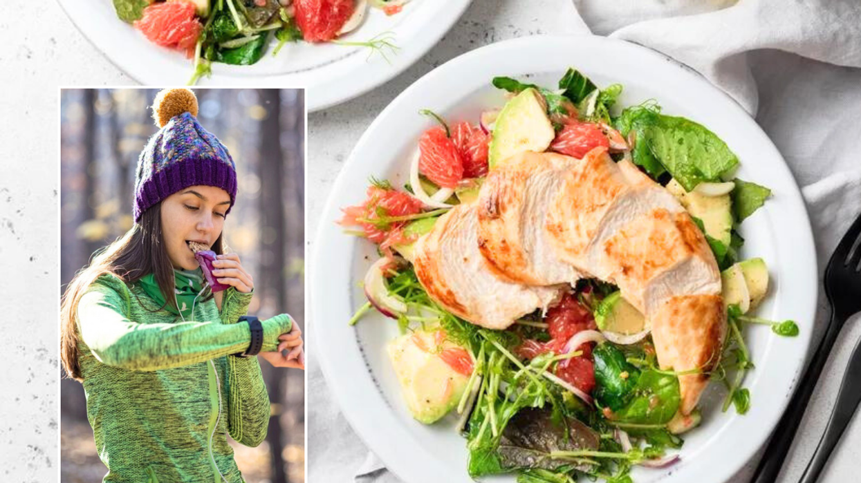 Woman eating protein bar / chicken salad
