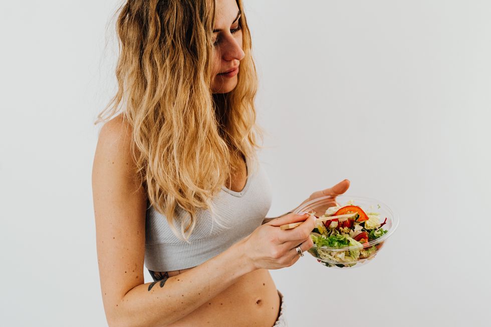 Woman eating salad
