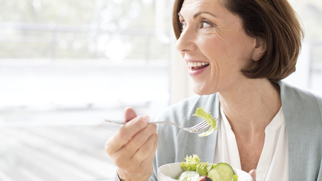 Woman eating salad