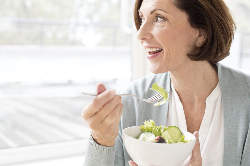 Woman eating salad