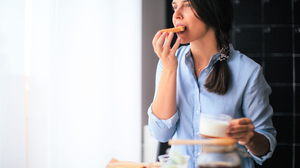 Woman eating toast