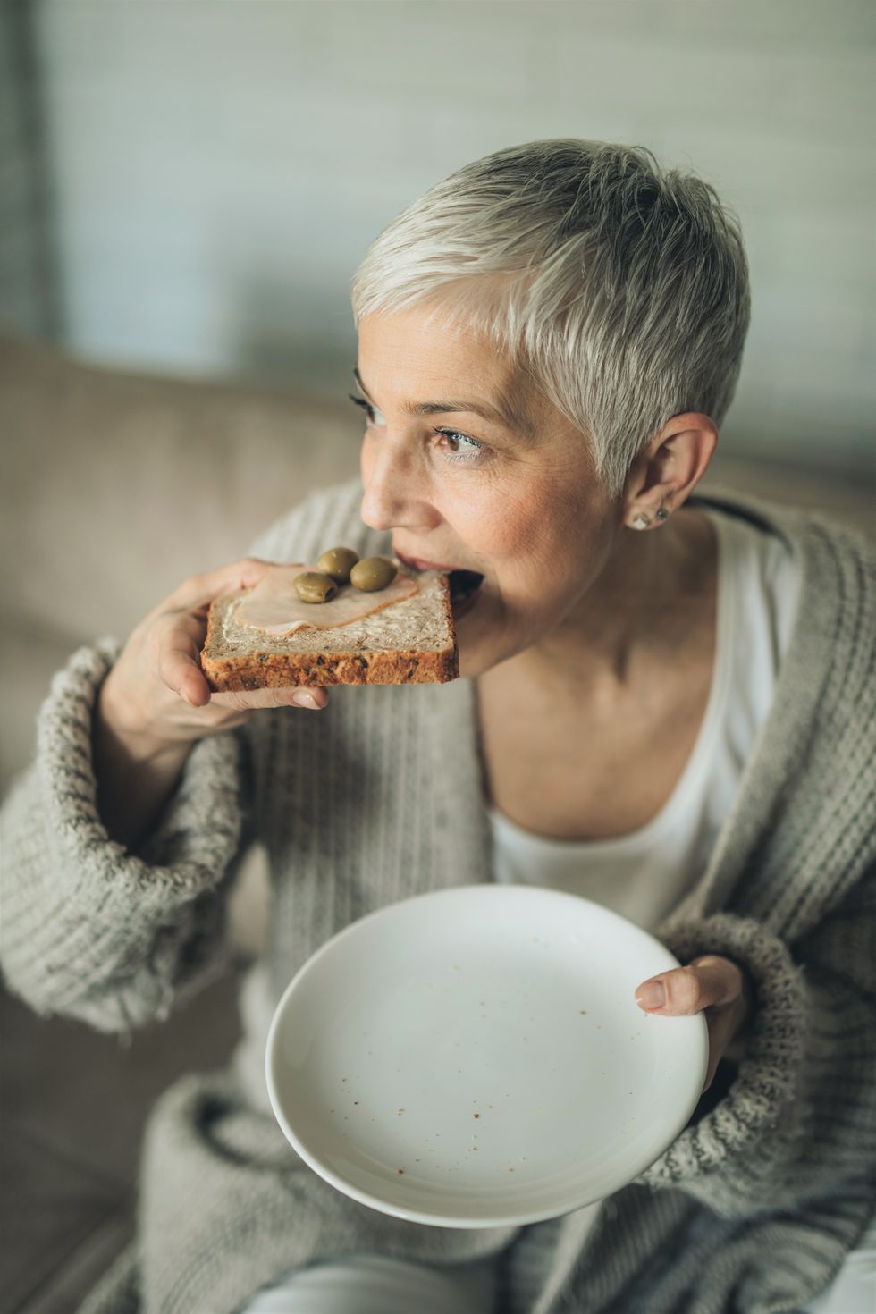 Woman eating toast