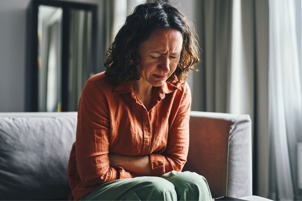 WOMAN EXPERIENCING DISCOMFORT