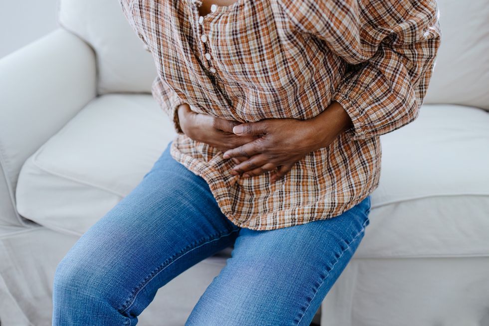 Woman experiencing stomach pain