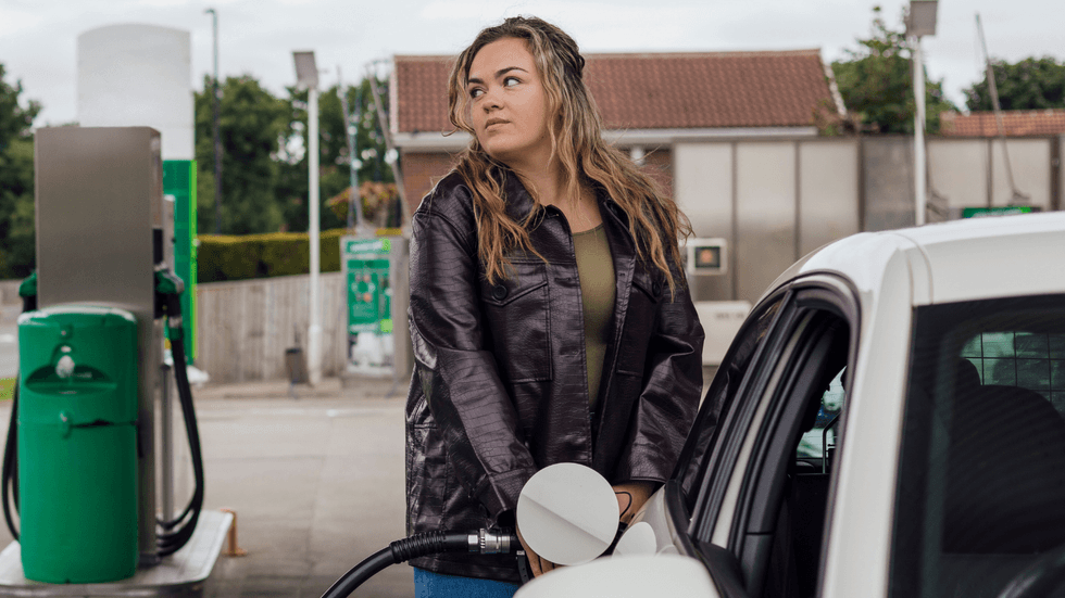 Woman filling up petrol tank
