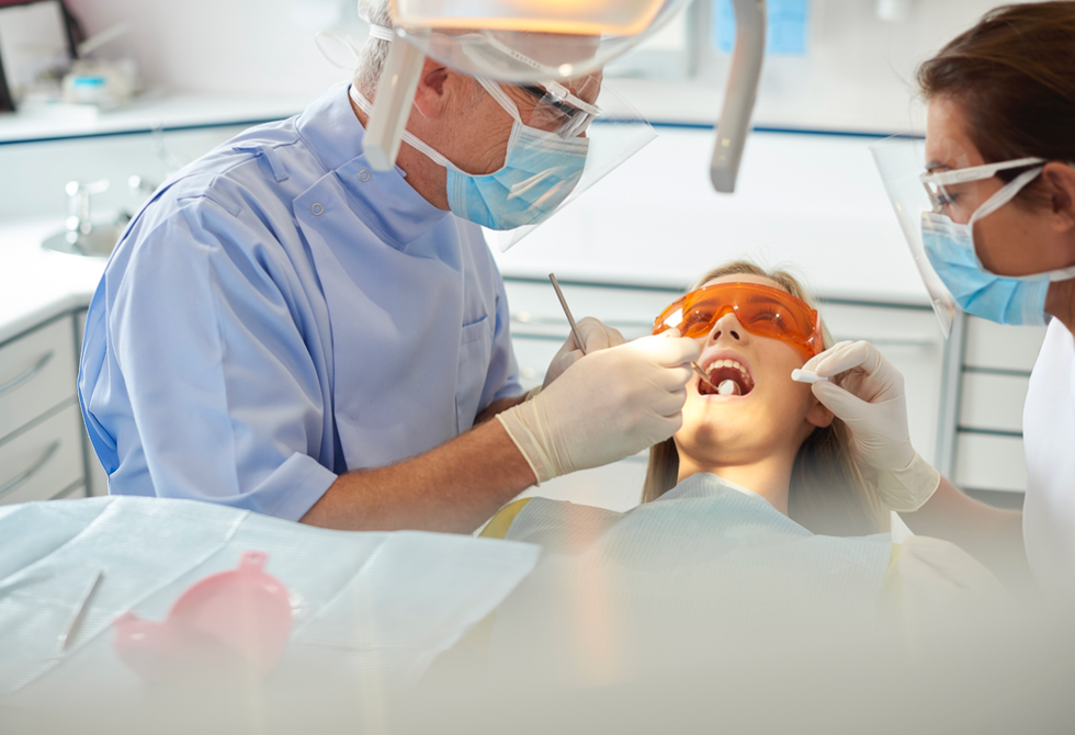 Woman getting dental surgery