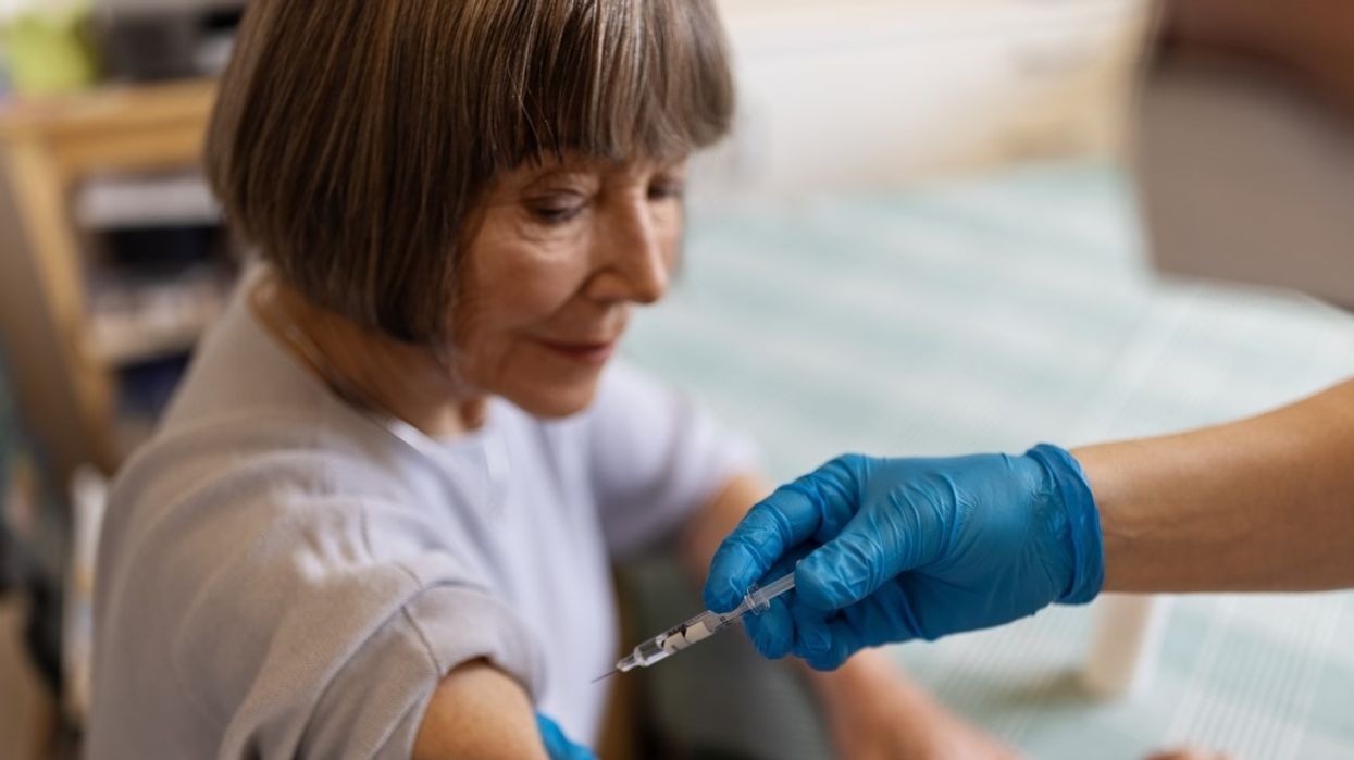 Woman getting flu jab