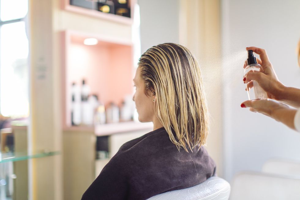 Woman getting haircut