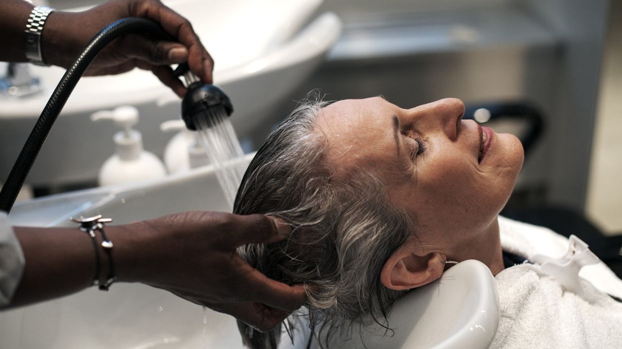 Woman getting her grey hair washed