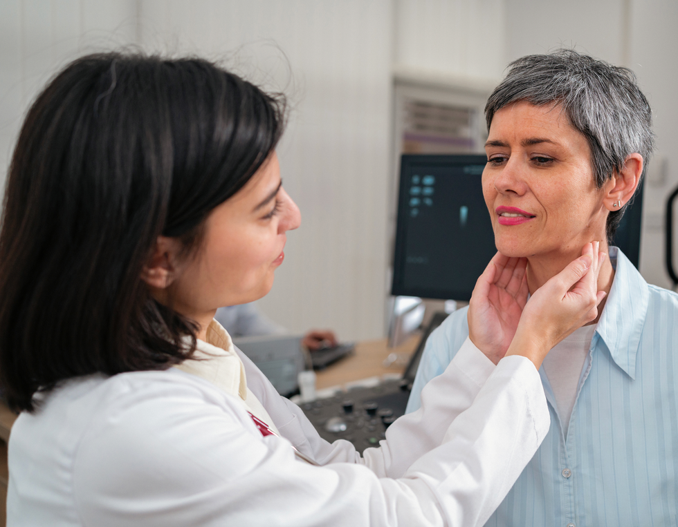 Woman getting neck examined