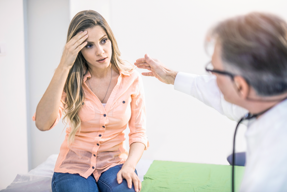 Woman getting seen by a doctor