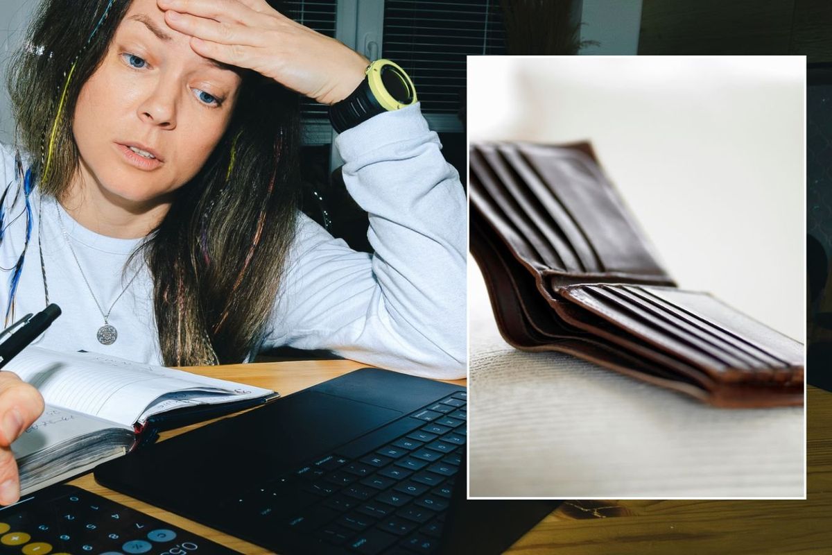 Woman going over finances and empty wallet
