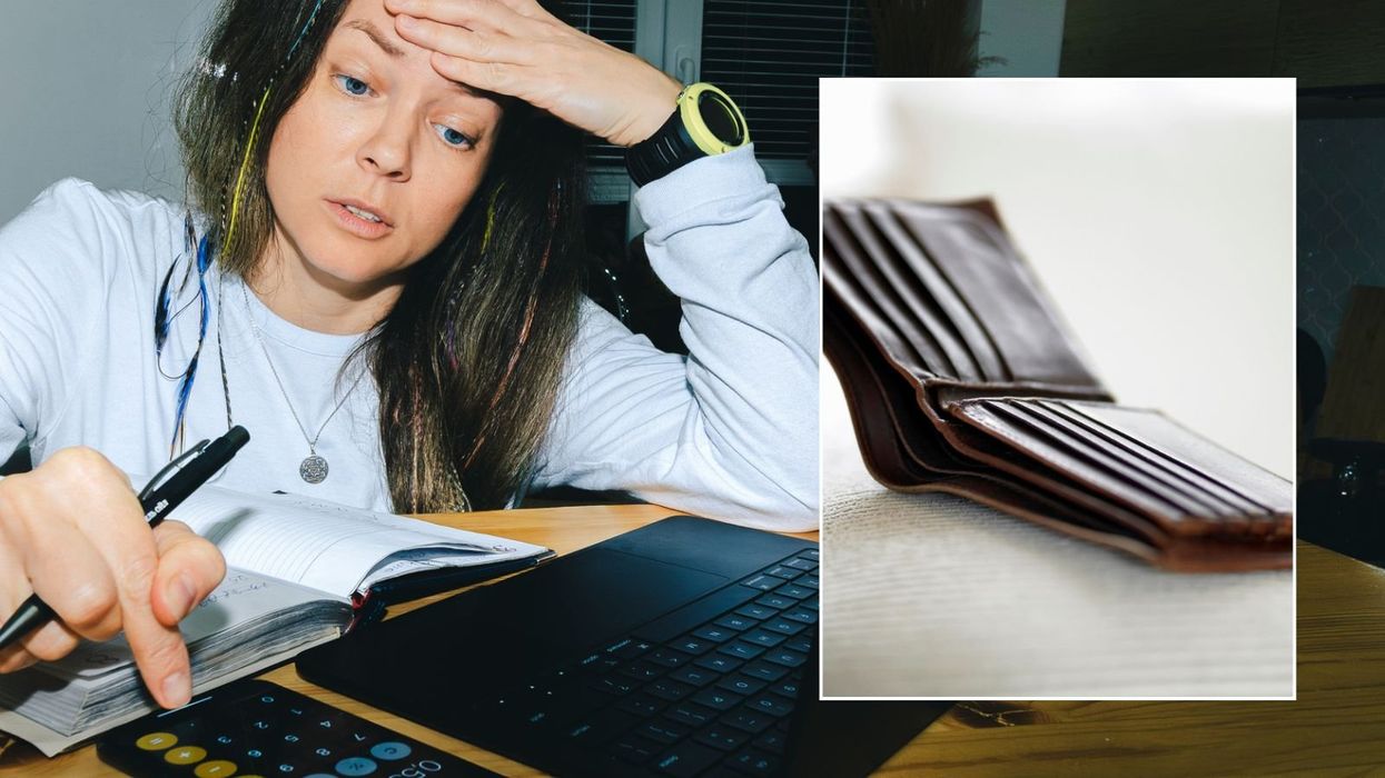 Woman going over finances and empty wallet