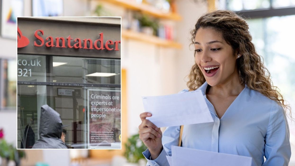 Woman happy looking at letter and Santander