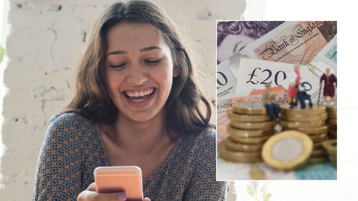 Woman happy looking at phone and money