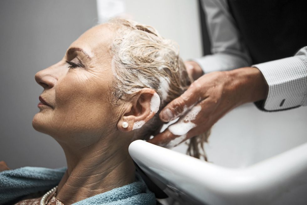 Woman having hair washed